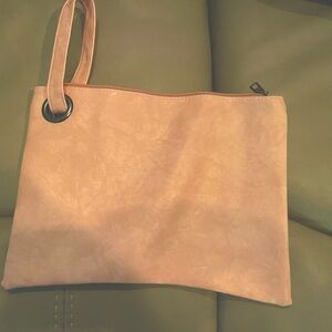 Muted light pink zippered bag with strap. Never used.